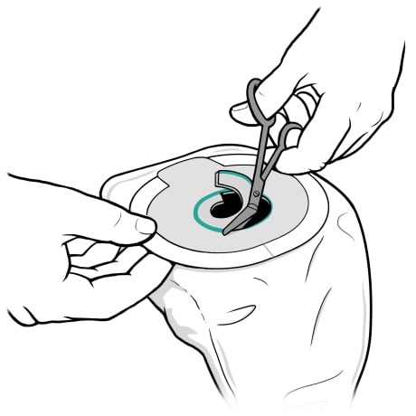 Person using curved scissors to cut opening.