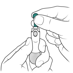 One hand holding lancet holder and other hand inserting lancet into lancet holder.