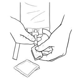 One hand holding valve tip of empty catheter bag with other hand cleaning valve tip with alcohol wipe.