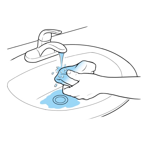 Getting folded cloth wet under faucet with running water.