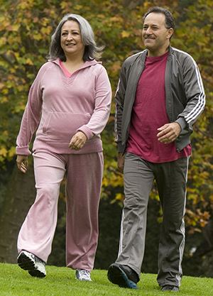 Man and woman walking outside.