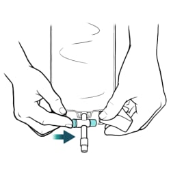One hand holding empty catheter bag and other hand pushing in valve to close it.