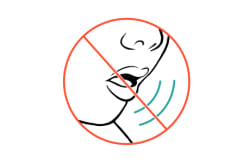 A "no" symbol over close-up of child’s face, showing that sound isn’t coming out of their mouth.