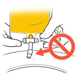 Valve tip touching toilet seat and prohibition symbol with arrow pointing toward valve tip.