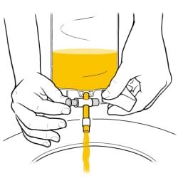Hands holding catheter bag over toilet with urine flowing into toilet.