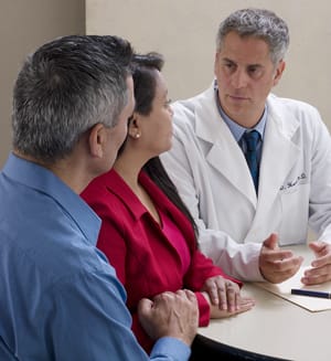 People talking to doctor.